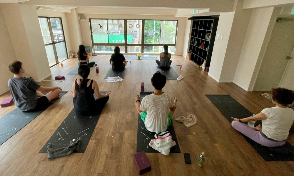 yoga students sitting in the yoga studio