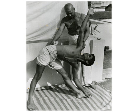 K. Pattabhi Jois (Guruji) assisting Sharath in Utthita Trikonasana