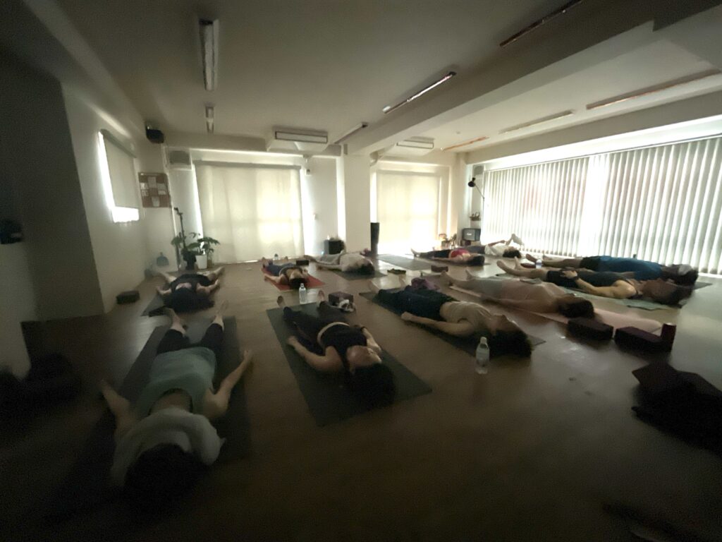 Yoga studio in Shibuya, popular vinyasa class, English available